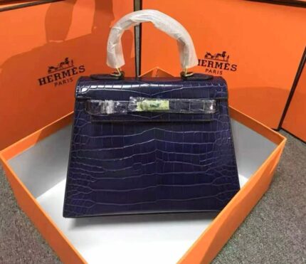 Hermès Mini Kelly bag in blue alligator embossed leather with gold hardware.
