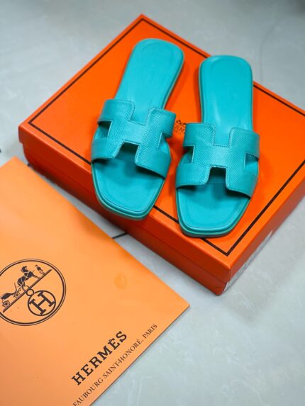 Hermès Oran sandals in bright blue