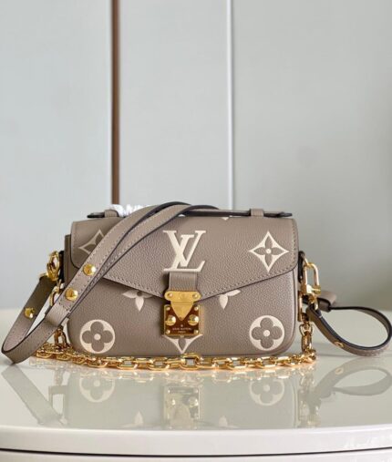 Louis Vuitton Pochette Métis East West bag in  bicolor monogram Empreinte leather