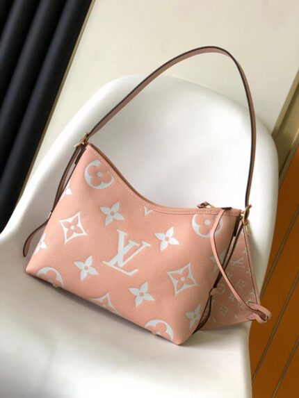 Louis Vuitton CarryAll PM bag in  Monogram Empreinte leather