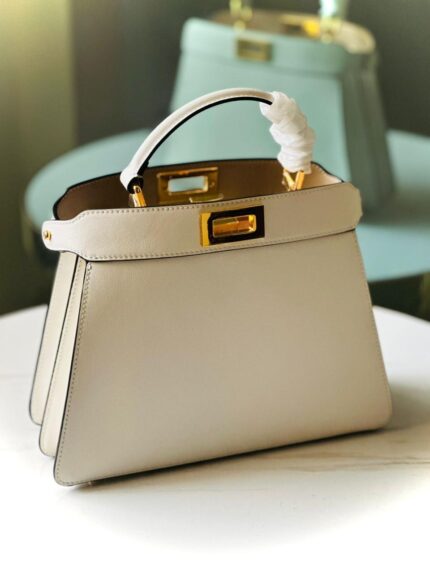 Fendi Peekaboo ISeeU bag, likely in a petite or nano size and a beige or white color