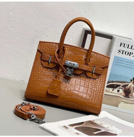 Hermès Birkin bag in a brown crocodile or alligator leather finish