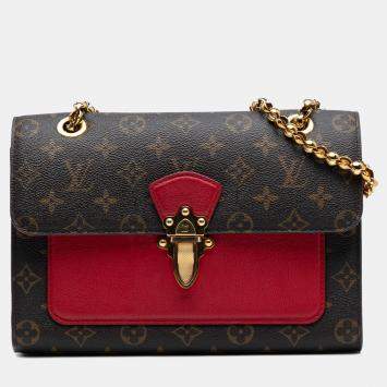 Louis Vuitton Victoire Monogram canvas and cerise red leather bag