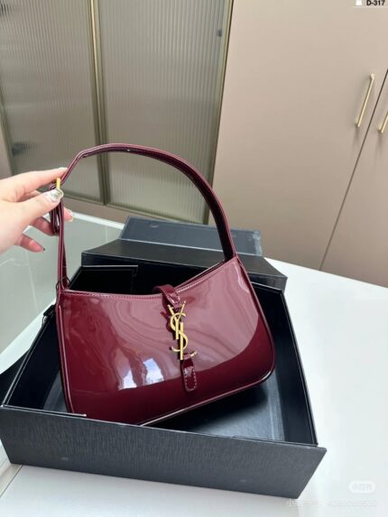 Saint Laurent Le 5 à 7 mini patent-leather shoulder bag in  burgundy color.