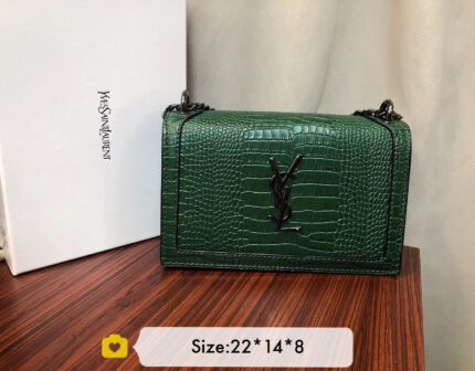 Saint Laurent Medium Sunset shoulder bag in green crocodile-embossed leather.