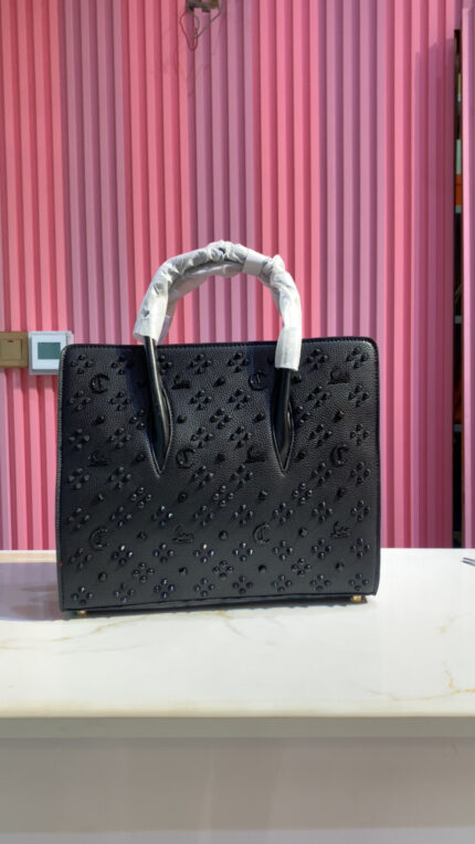 Christian Louboutin Paloma medium tote bag in black grained calf leather with signature Loubinthesky spikes
