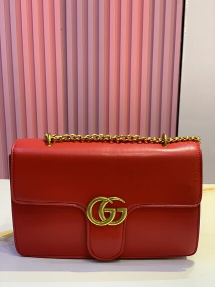 Red Gucci GG Marmont quilted mini leather shoulder bag.