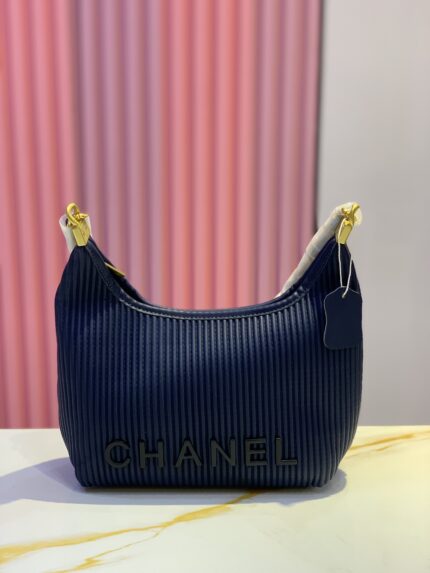 Chanel dark blue handbag with gold-tone hardware.