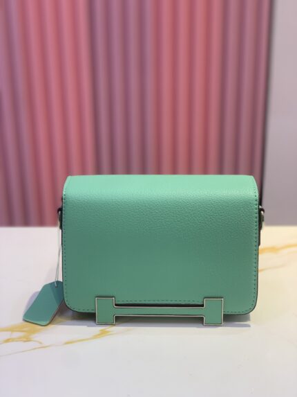 Hermès Geta bag in a green hue, likely Vert Fizz chevre leather
