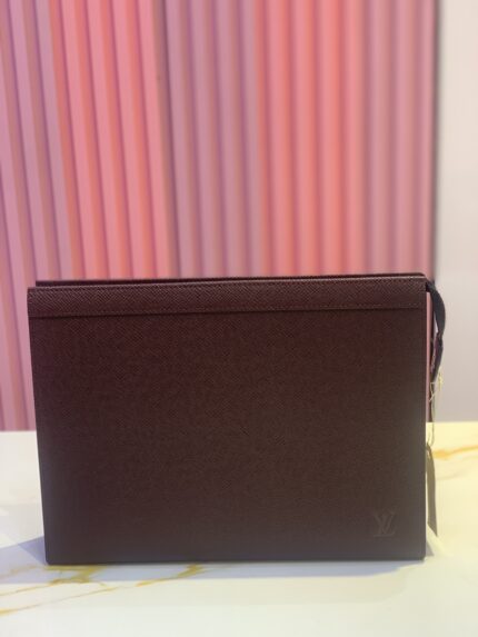 crossbody bag, possibly in a deep berry or burgundy color.