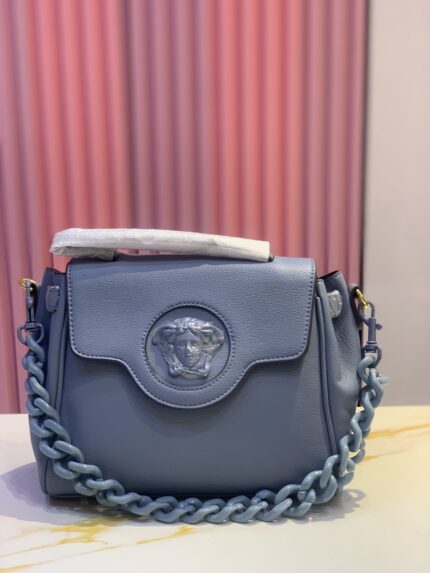 Versace Small La Medusa top handle bag in leather, likely in the "Lapis" blue color