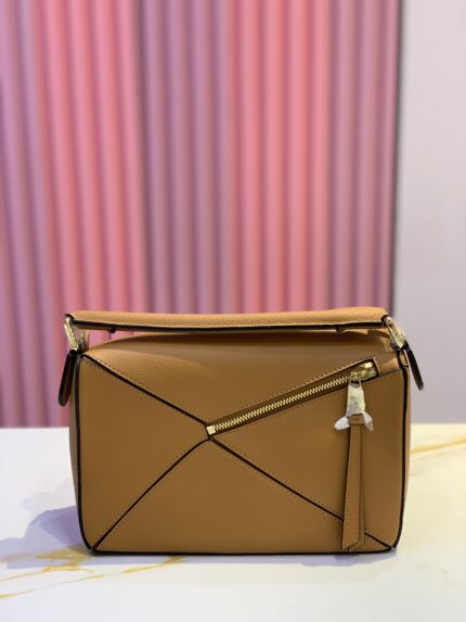 Loewe Puzzle bag, known for its distinctive geometric panels and origami-inspired shape
