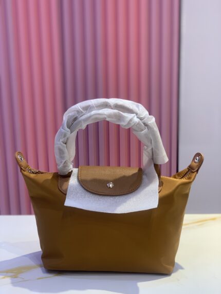 Longchamp Le Pliage Neo medium nylon tote bag in a brown or tan color