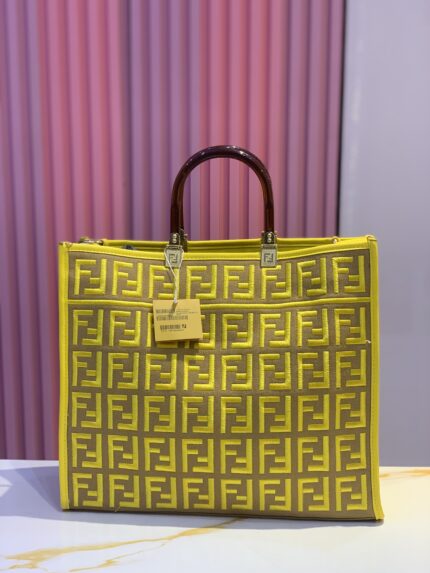 yellow and brown Fendi tote bag