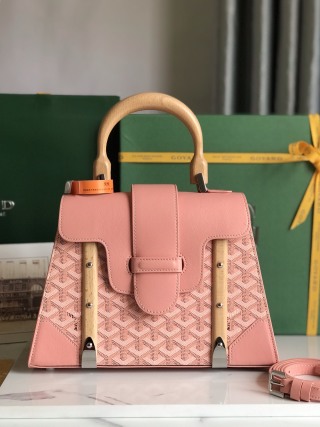 Goyard Goyardine Saigon PM bag in pink canvas with white and pink Goyard chevron and wooden handle and front panels