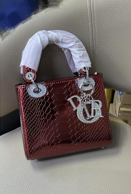 Dior mini bag in a shiny burgundy crocodile-embossed leather