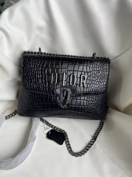Black crocodile-embossed leather Dior handbag with a chain strap
