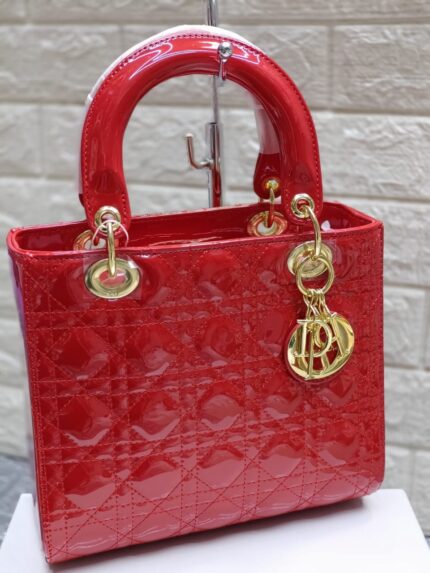 Lady Dior bag red patent calfskin featuring the iconic Cannage stitching