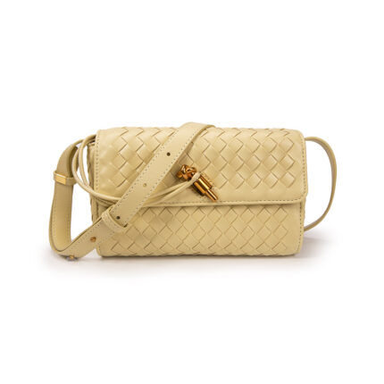Bottega Veneta Andiamo clutch in cream or gold-toned metallic leather with the Intrecciato weave technique